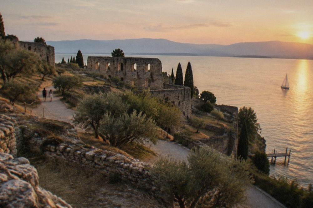 The stone walls and olive terraces of the Roman villa site at the tip of the Sirmione peninsula above the lake